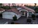 Charming single-story home featuring a brick-paved driveway and lovely landscaping in the front yard at 14248 N 56Th Pl, Scottsdale, AZ 85254