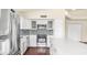 Updated kitchen with white cabinets, stainless steel appliances, mosaic tile backsplash, and a large island at 14248 N 56Th Pl, Scottsdale, AZ 85254