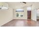 Vaulted ceiling and large window provide natural light in this living room with hardwood floors at 14248 N 56Th Pl, Scottsdale, AZ 85254