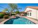 Backyard pool and spa combo, with a covered patio and lush landscaping for ultimate relaxation at 14248 N 56Th Pl, Scottsdale, AZ 85254