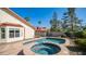 Backyard pool and spa combination with a stone surround, perfect for summer relaxation at 14248 N 56Th Pl, Scottsdale, AZ 85254