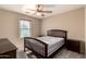 Cozy bedroom with neutral walls and carpet flooring, furnished with a bed and matching nightstands at 15010 W Hope Dr, Surprise, AZ 85379