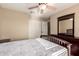 Bedroom featuring a plush bed, a large dresser, and a neutral color palette, creating a serene retreat at 15010 W Hope Dr, Surprise, AZ 85379