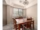 Comfortable dining area featuring a wooden table, chairs, and a chandelier creating the perfect place to gather at 15010 W Hope Dr, Surprise, AZ 85379