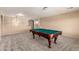 Large game room featuring plush carpet and a pool table, creating an entertainment space at 15010 W Hope Dr, Surprise, AZ 85379