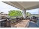 Spacious outdoor patio with grill and patio furniture for outdoor enjoyment at 17404 N 99Th Ave # 318, Sun City, AZ 85373