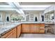 Large bathroom with granite countertops, wood cabinets, and plenty of vanity space at 17404 N 99Th Ave # 318, Sun City, AZ 85373