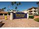 Exterior view of the community sign at The Heritage Senior Condominiums at 17404 N 99Th Ave # 318, Sun City, AZ 85373