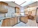 Modern kitchen featuring stainless steel dishwasher and ample countertop space at 17404 N 99Th Ave # 318, Sun City, AZ 85373