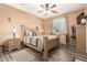 Serene bedroom with a ceiling fan, neutral walls, and a well-lit window at 17797 W Statler Dr, Surprise, AZ 85388