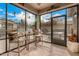 Inviting screened-in patio with comfortable seating and views of the outdoor area at 17797 W Statler Dr, Surprise, AZ 85388