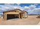 New home under construction, showcasing the framing and garage at 18232 W La Senda Dr, Surprise, AZ 85387