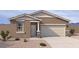 Charming single-story home with desert landscaping and a two-car garage at 18232 W La Senda Dr, Surprise, AZ 85387