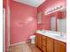 Primary bathroom with dual sink vanity, and complementary colored walls and tile at 20007 N Organ Pipe Dr, Surprise, AZ 85374