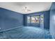 Spacious bedroom featuring a bay window overlooking the front yard at 20007 N Organ Pipe Dr, Surprise, AZ 85374