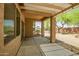 Covered patio with overhead shade structure, concrete flooring, and views of the well-maintained yard at 20007 N Organ Pipe Dr, Surprise, AZ 85374