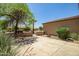 Beautifully landscaped front yard with lush greenery, desert plants, and a charming walkway to the entrance at 20007 N Organ Pipe Dr, Surprise, AZ 85374