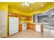 Well-maintained kitchen with appliances and tile floors, open to the living area at 20007 N Organ Pipe Dr, Surprise, AZ 85374