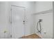 Clean laundry area with washer hookups, shelving, and neutral color scheme at 20007 N Organ Pipe Dr, Surprise, AZ 85374