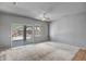 Living room featuring sliding glass doors leading to the backyard and ceiling fan at 20007 N Organ Pipe Dr, Surprise, AZ 85374