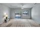 Bright, open living room with a sliding door leading to the backyard at 20007 N Organ Pipe Dr, Surprise, AZ 85374