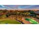 Aerial view of the backyard showing a grassy area, beautiful pool, and landscaping at 2106 E Beth Dr, Phoenix, AZ 85042
