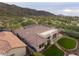An aerial view of a desert home featuring a private yard, patio, and mountain views at 2106 E Beth Dr, Phoenix, AZ 85042