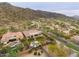 Aerial view of the property showcasing the pool, backyard, and the natural desert landscape at 2106 E Beth Dr, Phoenix, AZ 85042
