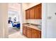 Cozy bar area that offers extra storage in addition to a sink and countertop at 2106 E Beth Dr, Phoenix, AZ 85042