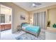 Bedroom with natural light, a stylish bed, and connected ensuite bathroom entrance at 2106 E Beth Dr, Phoenix, AZ 85042