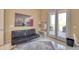 Bonus room featuring a futon, shelves, rug, and access to an outdoor area at 2106 E Beth Dr, Phoenix, AZ 85042
