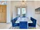 Dining room with a decorative chandelier, seating for eight, and access to the outdoor patio at 2106 E Beth Dr, Phoenix, AZ 85042