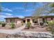 Charming single-story home with desert landscaping, stone accents, and a tile roof at 2106 E Beth Dr, Phoenix, AZ 85042