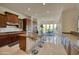 Kitchen view showcasing the breakfast bar, stainless steel appliances, and sight lines to the dining area at 2106 E Beth Dr, Phoenix, AZ 85042
