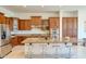 Spacious kitchen with stainless steel appliances, a large island, and wooden cabinets at 2106 E Beth Dr, Phoenix, AZ 85042