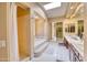 Elegant main bathroom with a jacuzzi tub, step-up platform, and separate vanity areas at 2106 E Beth Dr, Phoenix, AZ 85042