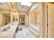 Bright main bathroom with a jacuzzi tub, dual vanities, and access to the main bedroom at 2106 E Beth Dr, Phoenix, AZ 85042