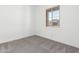 Carpeted bedroom with window at 21838 E Bonanza Ct, Queen Creek, AZ 85142