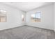 Spacious carpeted bedroom with neutral walls and bright natural light at 21838 E Bonanza Ct, Queen Creek, AZ 85142