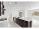 Open-concept kitchen featuring a large island with seating and sleek stainless steel appliances at 21838 E Bonanza Ct, Queen Creek, AZ 85142
