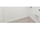 Clean and simple laundry room features neutral walls and wood-look flooring at 21838 E Bonanza Ct, Queen Creek, AZ 85142