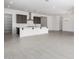 Bright open space with modern lighting adjacent to the kitchen and dining area at 21838 E Bonanza Ct, Queen Creek, AZ 85142