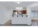 Open kitchen featuring granite countertops, stainless steel appliances, and wood cabinetry at 2318 W Kristina Ave, San Tan Valley, AZ 85144