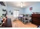 Bedroom featuring wood floors, bunk beds with slide, ceiling fan, and built-in shelving at 238 W Marco Polo Rd, Phoenix, AZ 85027