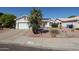 Charming single-story home with desert landscaping and solar panels on the roof at 238 W Marco Polo Rd, Phoenix, AZ 85027