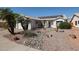 Charming single-story home with desert landscaping and solar panels on the roof at 238 W Marco Polo Rd, Phoenix, AZ 85027