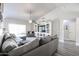 Bright open-concept living room with modern furniture and neutral tones at 238 W Marco Polo Rd, Phoenix, AZ 85027