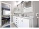 Bright bathroom featuring double vanity, marble countertop, and brushed nickel faucets at 238 W Marco Polo Rd, Phoenix, AZ 85027