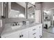 Bright bathroom featuring double vanity, marble countertop, and brushed nickel faucets at 238 W Marco Polo Rd, Phoenix, AZ 85027
