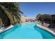 Backyard view showcasing a shimmering pool with a safety fence at 238 W Marco Polo Rd, Phoenix, AZ 85027